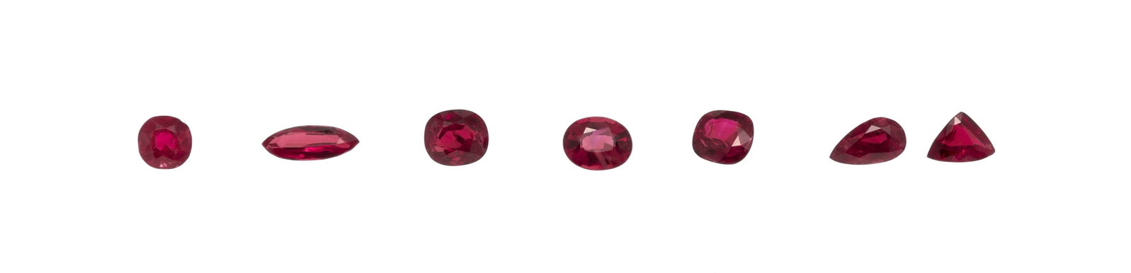 Lot de 7 rubis de différentes tailles sur papier de respectivement 1.34 ct, 1.20 ct, 1.12 ct, 1 (1 of 1)