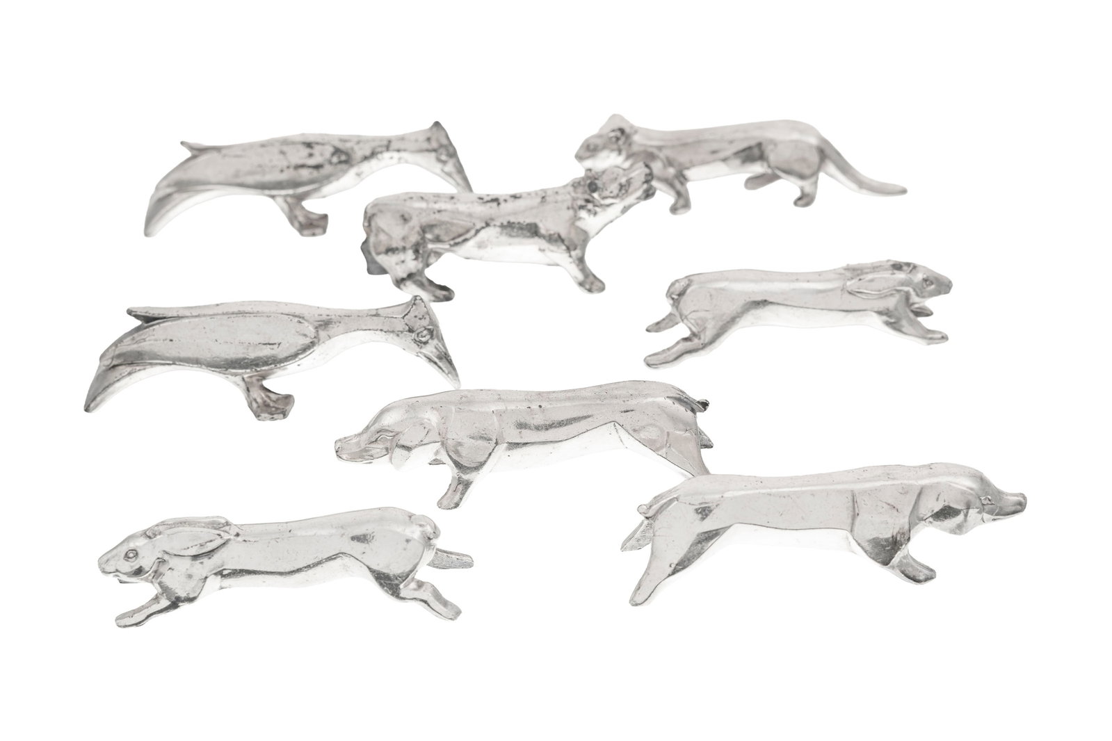 Suite de 8 porte-couteaux animaux en métal argenté, dans le goût de Sandoz pour Galli: Suite de 8 porte-couteaux animaux en métal argenté, dans le goût de Sandoz pour Gallia, XXe s., long. env. 8,5 cm Condition piqures dégâts traces d'usage