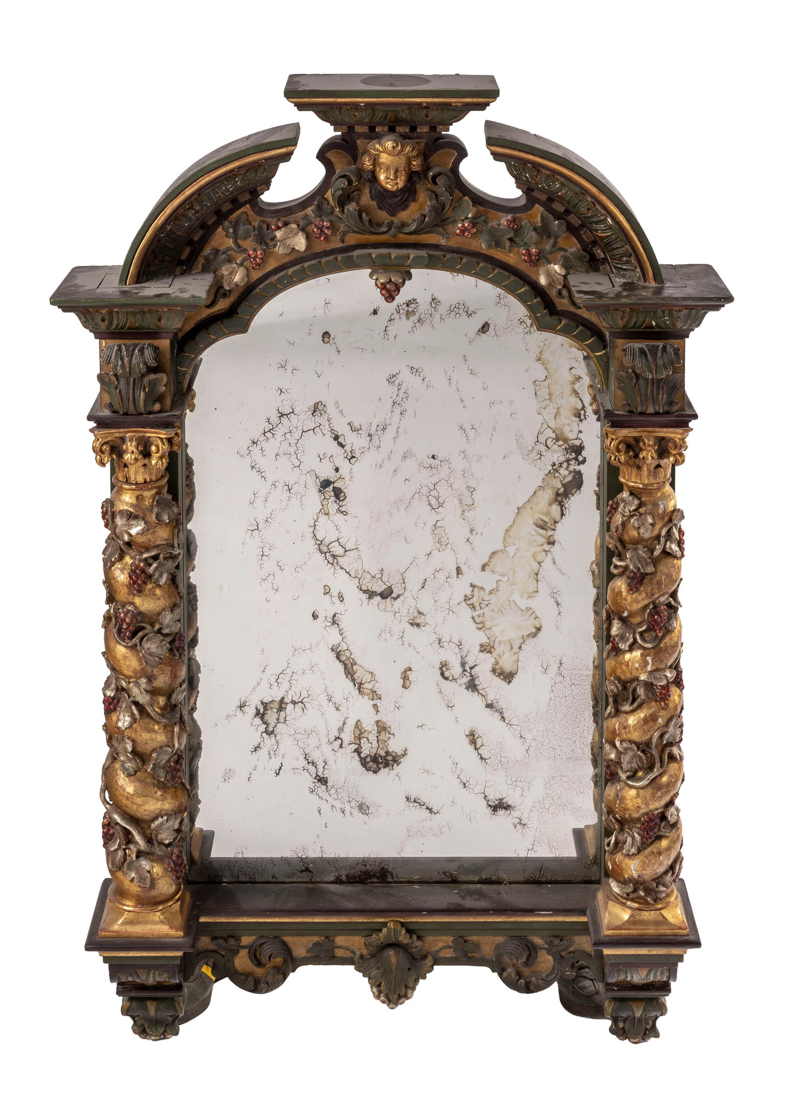Miroir, Italie, XXe s., en bois sculpté polychrome et doré, montants flanqués de colo: Miroir, Italie, XXe s., en bois sculpté polychrome et doré, montants flanqués de colonnes torsadées et ornées de pampres de vigne, fronton orné de la tête du putto,