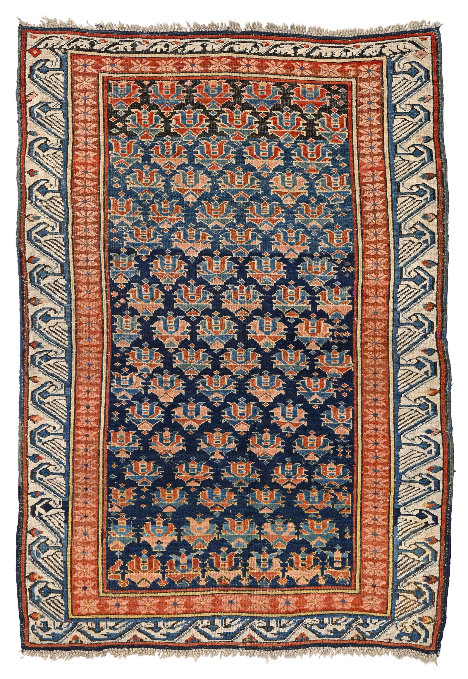 Tapis Daghestan, Caucase, milieu du XXe s., à semis de fleurs stylisées sur fond bleu mari: Tapis Daghestan, Caucase, milieu du XXe s., à semis de fleurs stylisées sur fond bleu marine, bordure beige, 115x166 cm