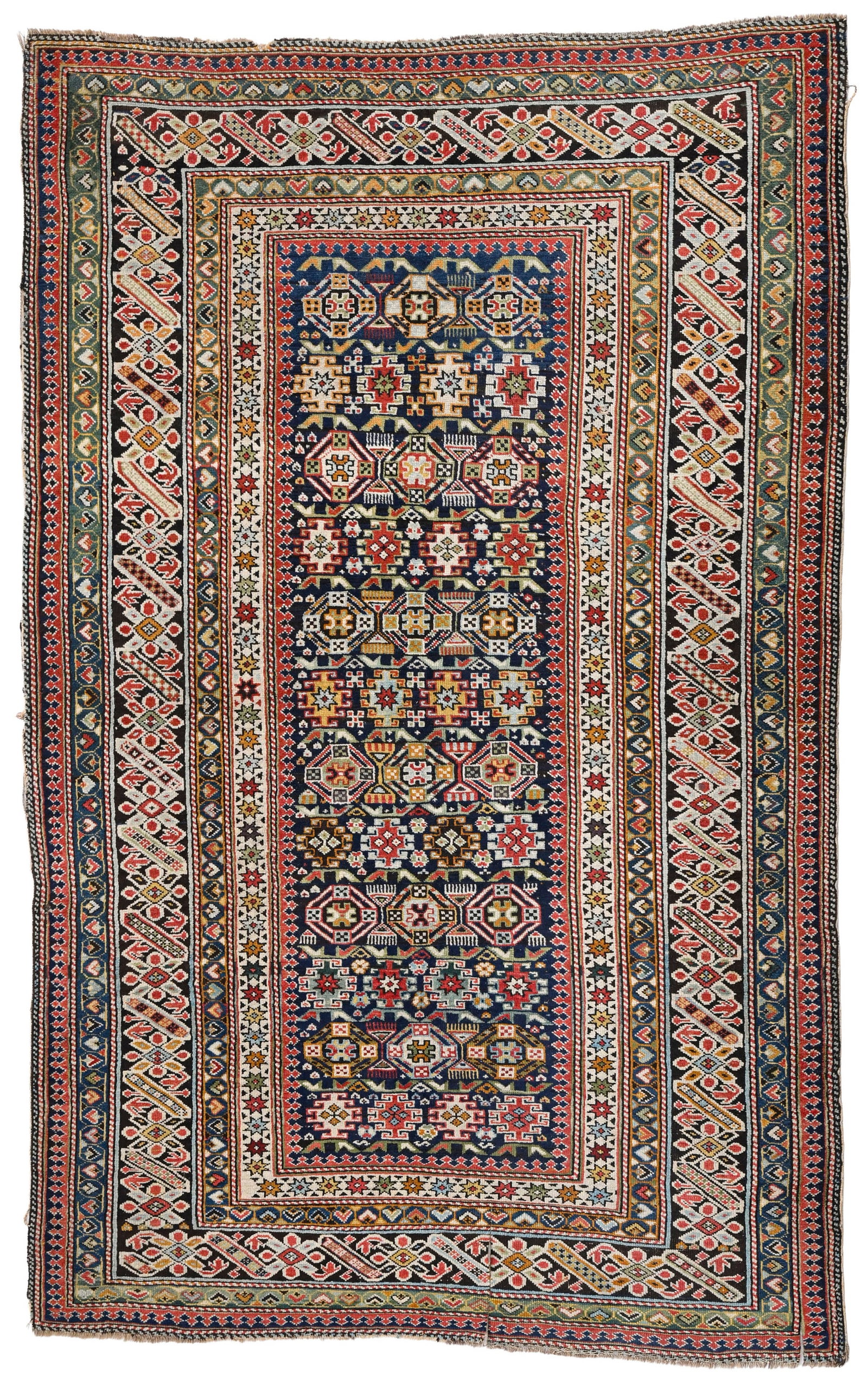 Tapis Shirvan, Caucase, milieu du XXe s., à semis de divers petits médaillons polychromes : Tapis Shirvan, Caucase, milieu du XXe s., à semis de divers petits médaillons polychromes sur fond bleu, bordure noire ornée d'une frise de motifs géométriques, 125x193 cm