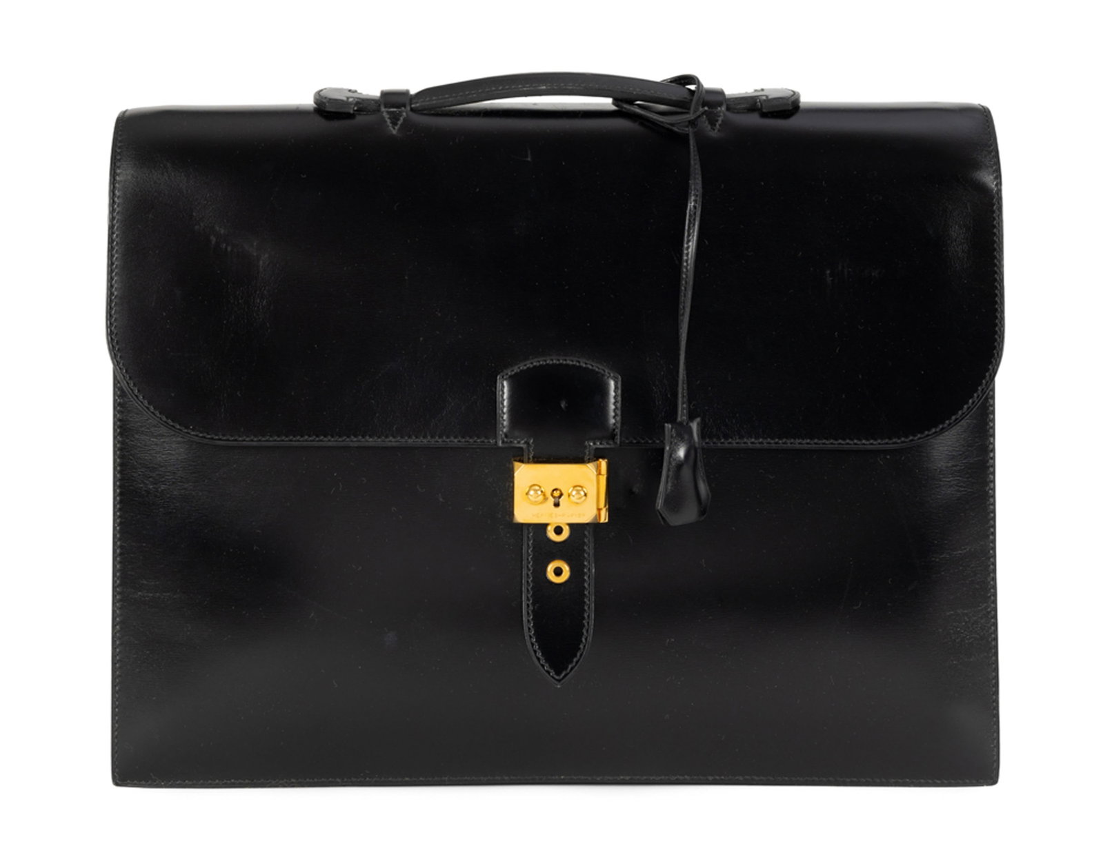 Hermès, sac à dépêches en cuir de box, année 1988, double soufflet, boucler: Hermès, sac à dépêches en cuir de box, année 1988, double soufflet, bouclerie plaquée or, tirette et clochette avec 2 clefs, housse, 29x38 cm Condition Excellent