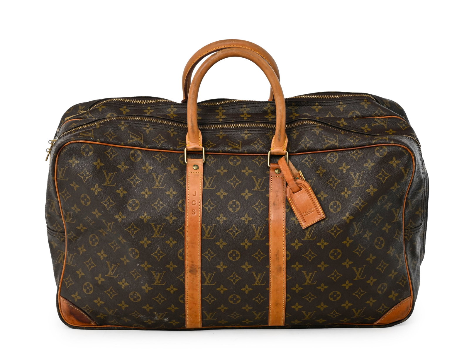 Louis Vuitton, sac Sirius en toile enduite Monogram et cuir naturel, deux compartiments, 33x57x17 cm: Louis Vuitton, sac Sirius en toile enduite Monogram et cuir naturel, deux compartiments, 33x57x17 cm Condition Mauvais état de conservation Usures aux éléments en cuir Taches d'