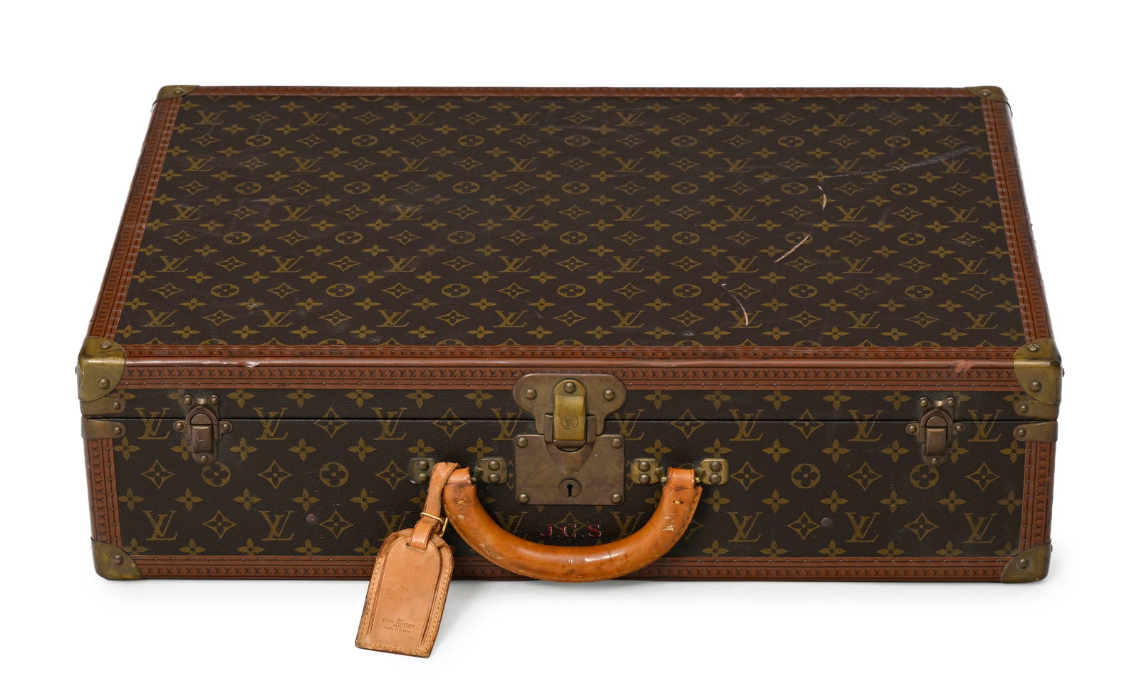 Louis Vuitton, valise rigide Bisten 65 en toile enduite Monogram, poignée en cuir, cornièr: Louis Vuitton, valise rigide Bisten 65 en toile enduite Monogram, poignée en cuir, cornières en lozine, coins, équerres et serrure en laiton, 44x65x18 cm