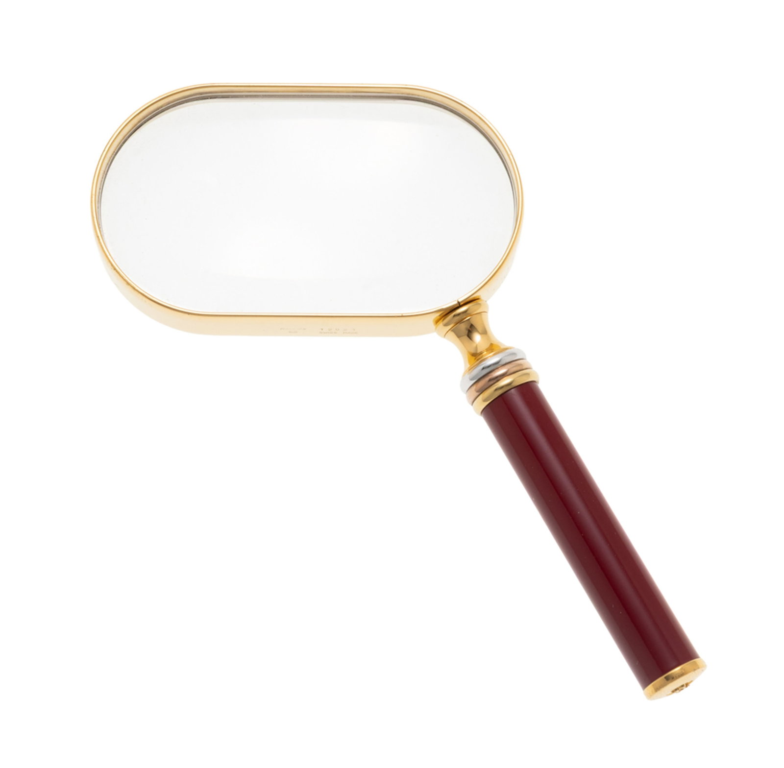 Cartier, loupe de lecture plaqué or et résine bordeaux, signée, numérotée 1 - 2