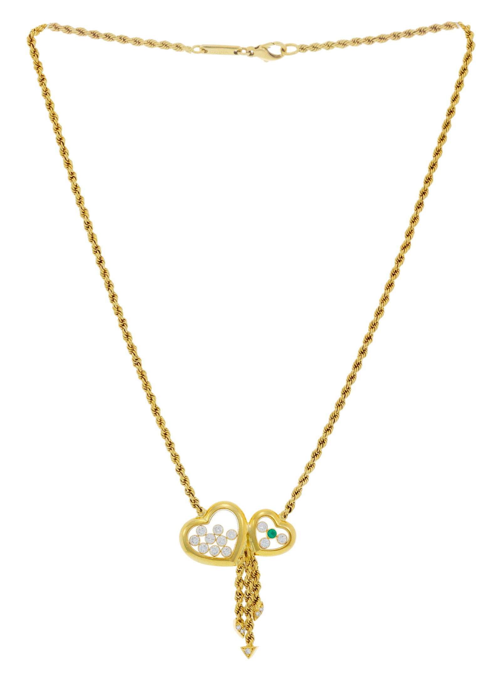 Chopard, Happy Diamonds, collier or 750 à maille torsadée retenant un centre formé de: Chopard, Happy Diamonds, collier or 750 à maille torsadée retenant un centre formé de deux cœurs ornés d'une émeraude et de diamants taille brillant mobiles entre deux