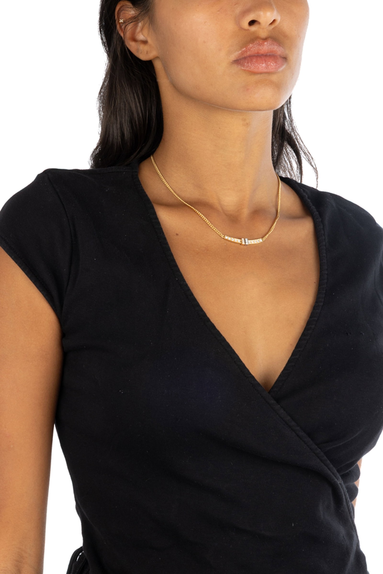Collier or 750 à maille gourmette retenant un centre serti de diamants taille brillant, long. 4 - 4