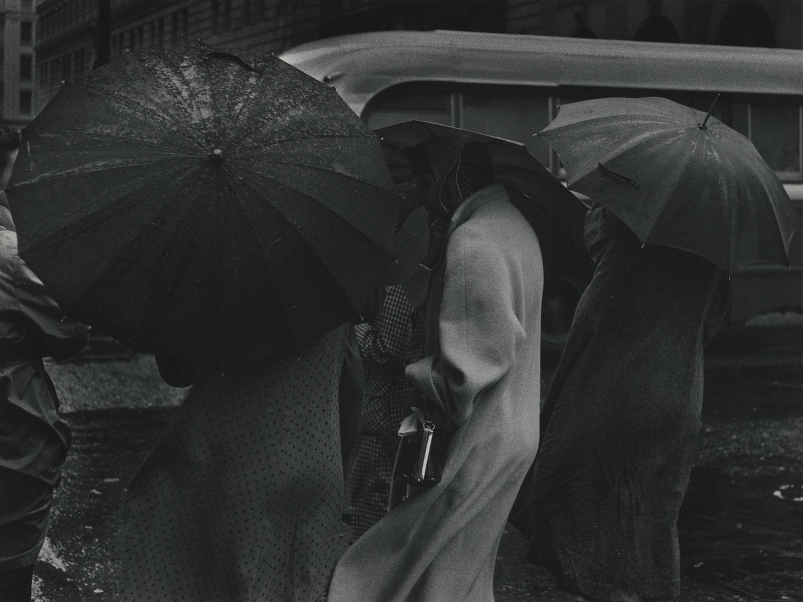 Pirkle Jones, Figures in the Rain, 1955: Pirkle Jones, Figures in the Rain, San Francisco, 1955. gelatin silver print from Portfolio 2, printed 1968, 10 x 13 3/8 inches on a 14 x 18 inch mount. Signed on the mount verso.>br> Condition is exc