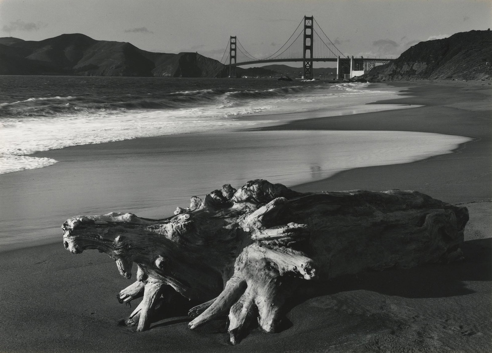 Pirkle Jones, Log and Golden Gate, 1952: Pirkle Jones, Log and Golden Gate Bridge, San Francisco, 1952. gelatin silver print from Portfolio 2, printed 1968, 9 1/2 x 13 1/4 inches on a 14 x 18 inch mount. Signed on the mount verso. Condition: