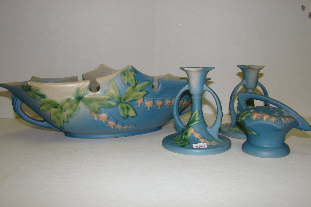 4-piece set of Roseville Bleeding Heart including : including console bowl, candlesticks, and flower frog