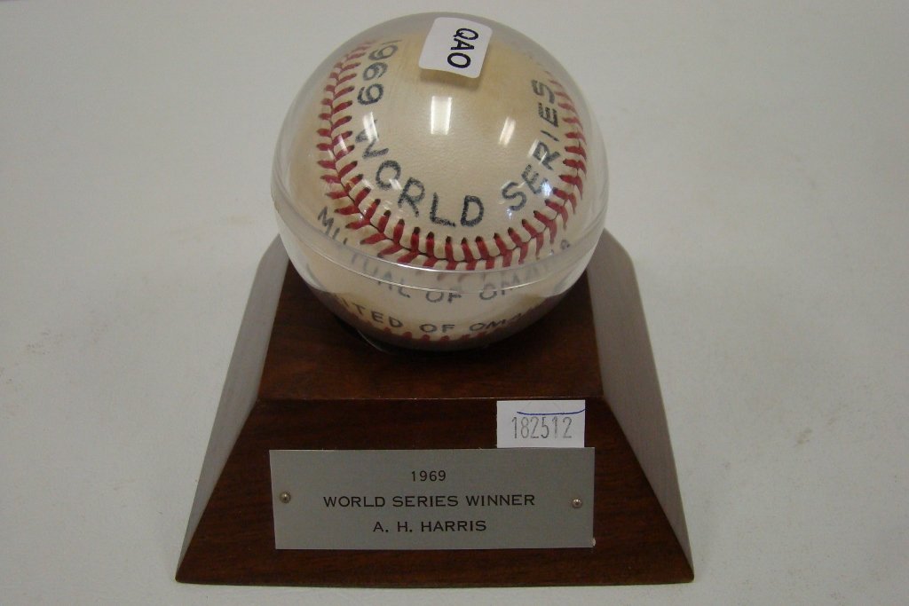 A presentation baseball marked 1969 World Series, : Series, Mutual of Omaha United of Omaha, signed in green ink by Casey Stengel with a snapshot of Casey with showgirls after the 1969 World Series