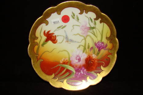 An 8 1/2" hand painted Pickard plate on a Limoges b: blank, decorated with carnations and butterfly, signed Yesmek