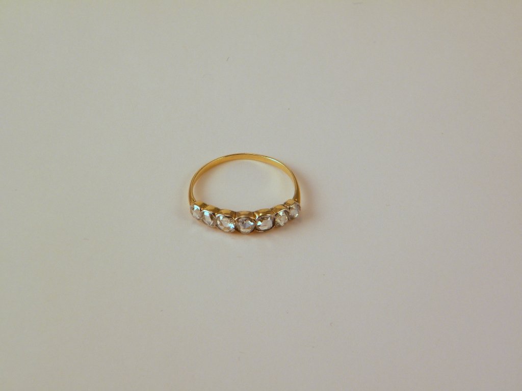 A yellow gold ring with 7 rose cut diamonds unmark: unmarked but tested 14 kt, size 8.5