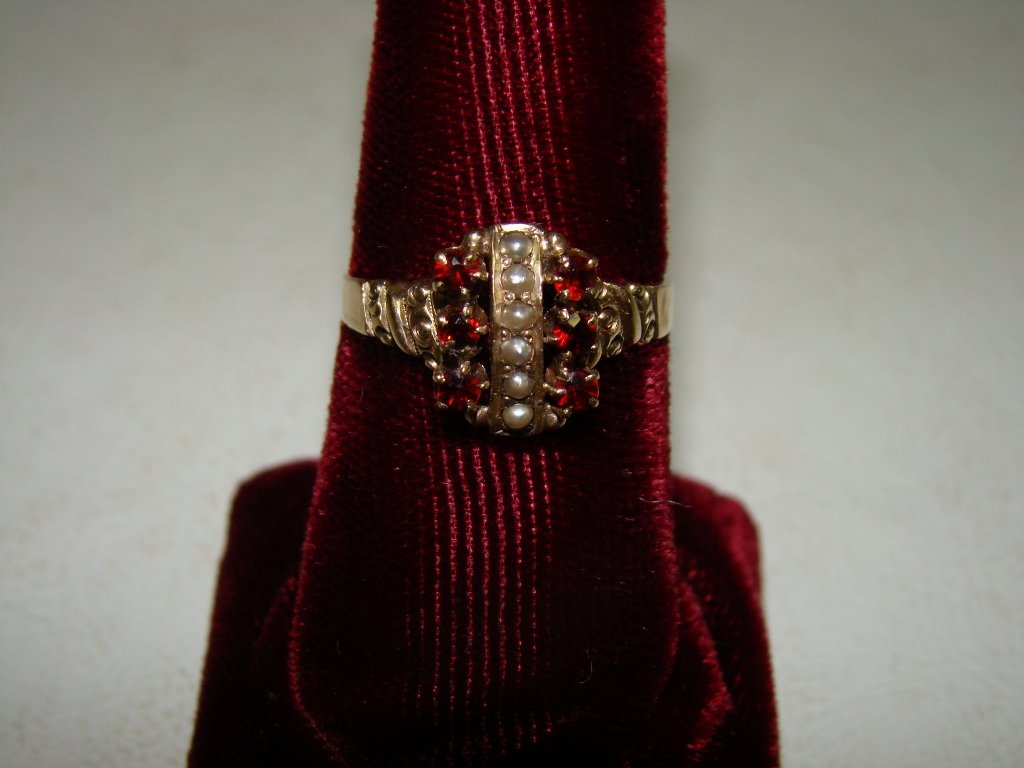 A 14kt rose gold Victorian ring with 6 seed pearls: with 6 seed pearls and 6 garnets, size 8 1/2