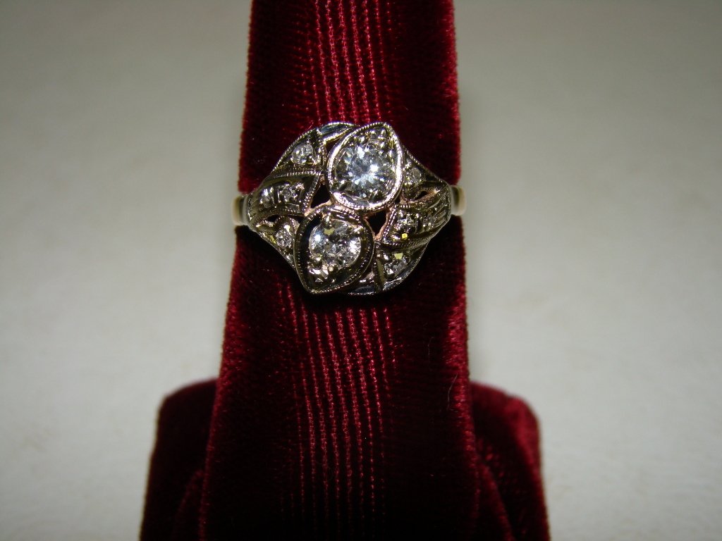 A yellow gold ring, unmarked but tested 14kt with: with .63 total weight diamonds, size 6 1/2