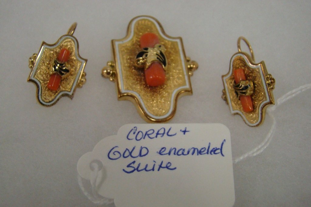 A gold and gold-filled enameled and coral brooch a: and matching pierced earrings