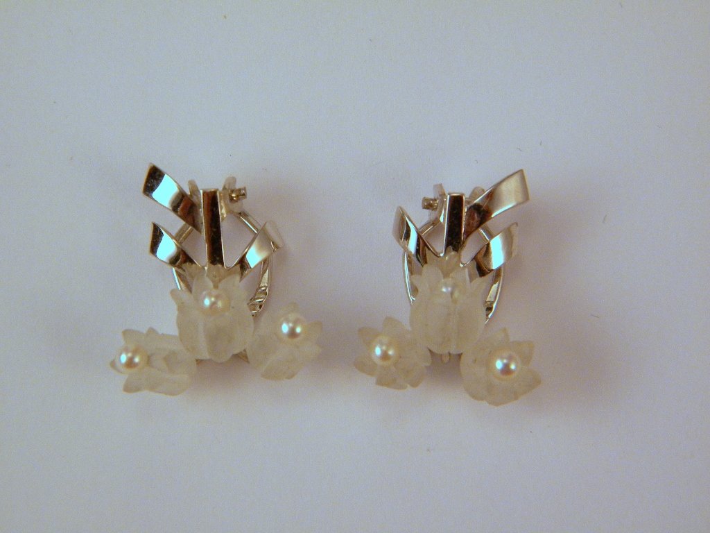A pair of 14kt white gold Omega clip earrings with: with 6 seed pearls and frosted glass