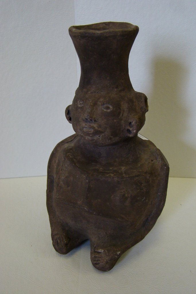 Pre-Columbian Mesoamerican style effigy vessel in : effigy vessel in the female human form bearing physical abnormalities. Attributed to southern region of Mesoamerica or Northern South America. Believed to be authentic, but not certified