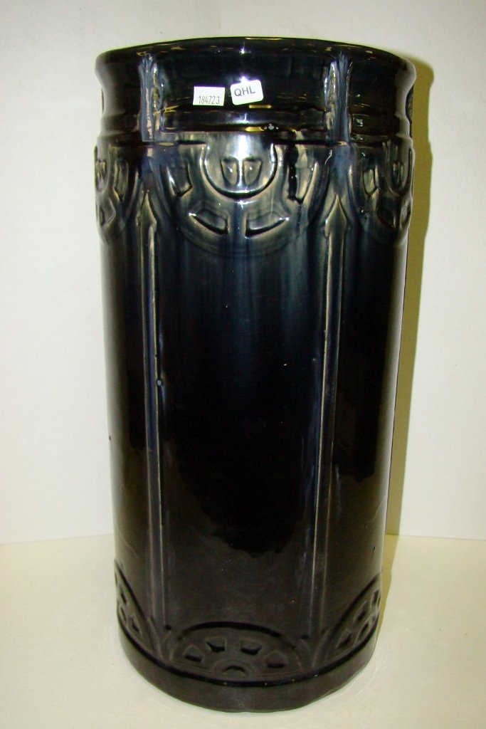 An Arts and Crafts style art pottery umbrella stan: stand, 20 1/2" high with black glaze and gray highlights