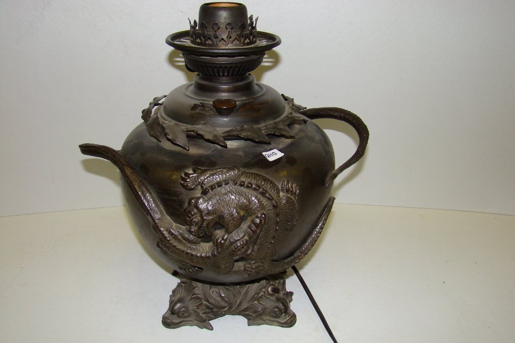 An electrified Oriental style metal kerosene large: large lamp font with handles 13" in diameter, with dragon motif , no chimney or shade