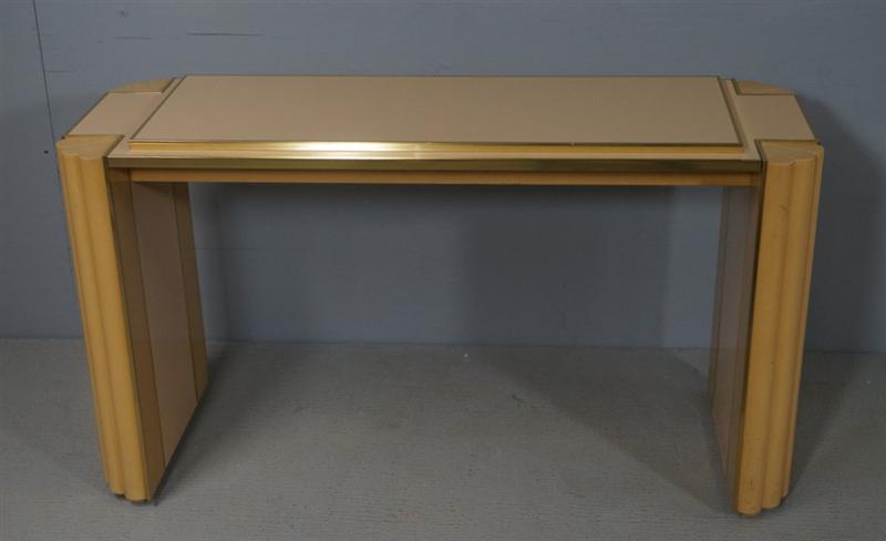 Alain Delon Console France: Vintage original console comprised of two-tone ivory lacquered wood, designed by Alain Delon for Maison Jansen. This sophisticated design features a raised and bronzed edged display top, and scalloped