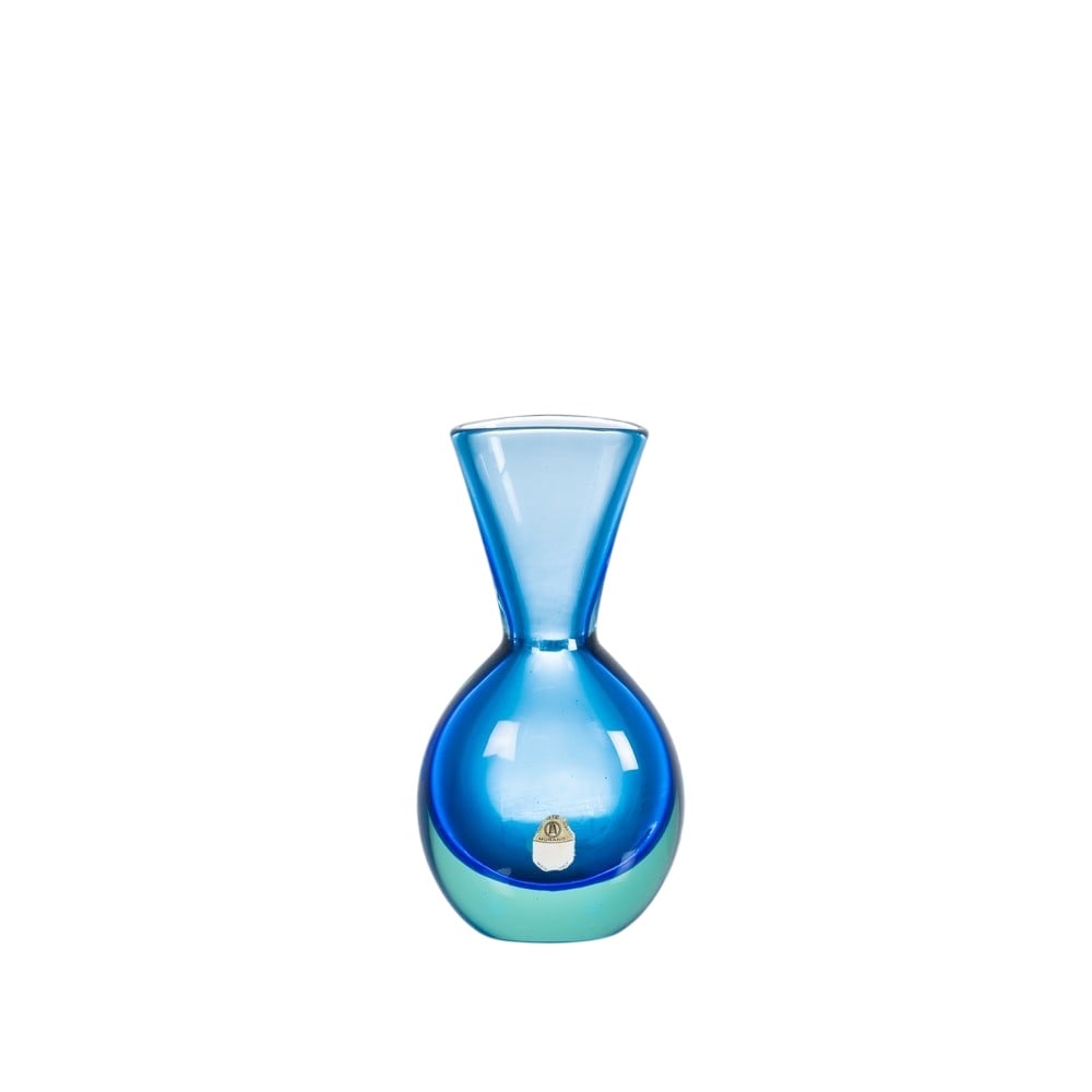 “11824” model glass vase by Flavio Poli: FLAVIO POLI Made by Seguso, Italy, ca. 1960.Vase model “11824” in azure blue sommerso glass with a spherical body, flat circular mouth, and flared neck. Production label.