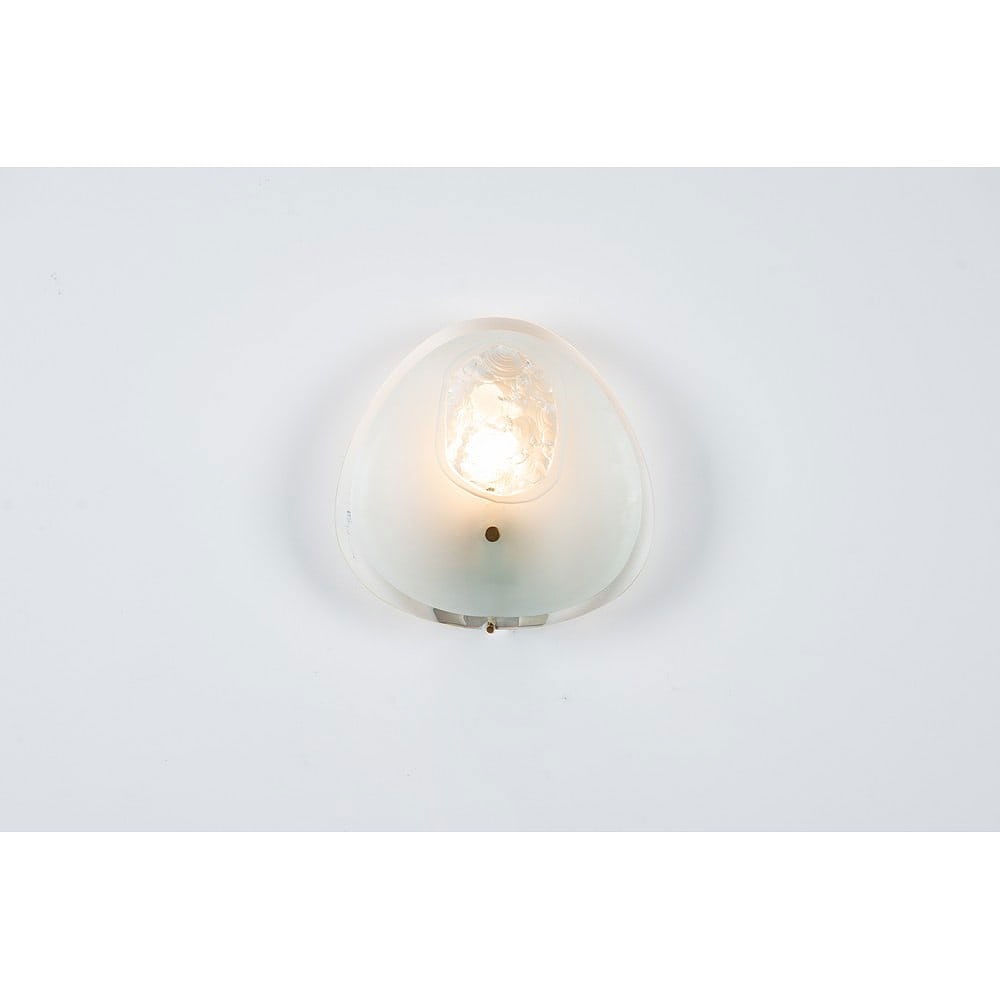 “1944?? MODEL WALL LAMP BY MAX INGRAND: MAX INGRAND Produced by Fontana Arte, Italy, ca. 1947 One-light wall lamp, model "1944" in curved satin-finish crystal with a chiseled decoration, uneven sand-etched edges on a frosted background,