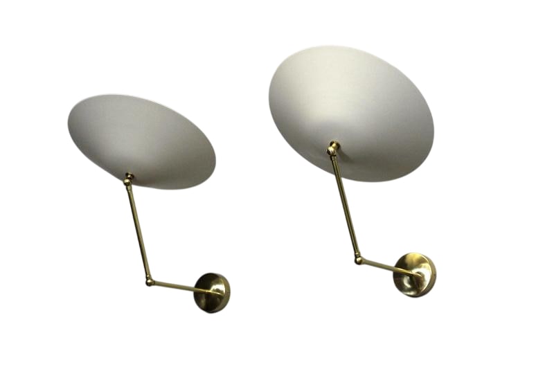 Pair of Italian Sconces: Limited Edition pair of Italian Sconces. Each sconce has one candelabra socket. Sconces can be adjusted to different positions as shown in the pictures. High quality brass. Very nice and really good I