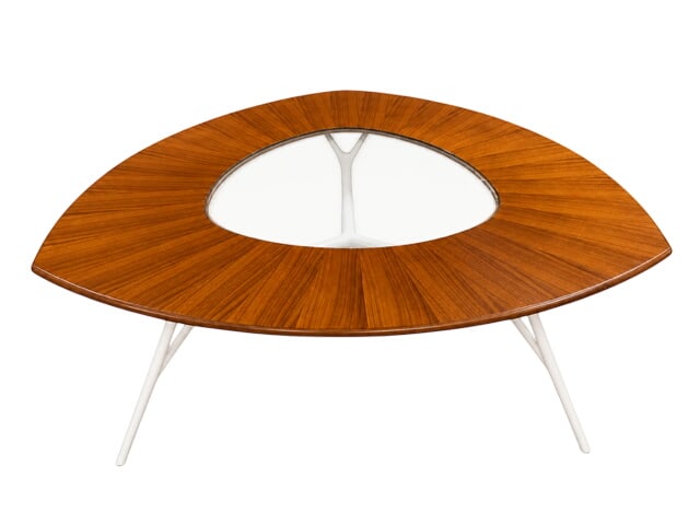 Studio Le Opere e i Giorni Dining Table: Contemporary architectural dining table designed by Studio Le Opere e i Giorni It features a striking, triangular reist-shaped wood top (often finished in high-quality walnut) with a cutout center con