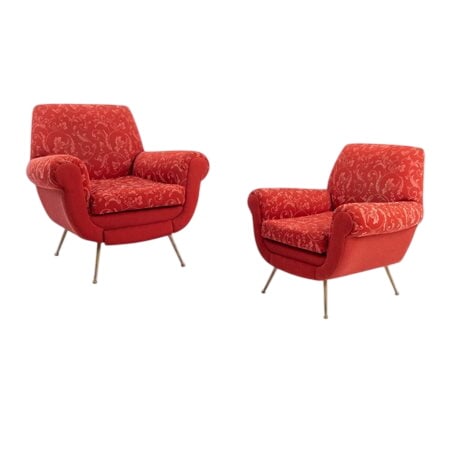 Pair of Lounge Chairs by Gigi Radice: GIGI RADICE Made in Italy, circa 1950. Pair of armchairs with wooden frame, padded seat and backrest, upholstered in solid red and floral fabric. Brass spiked feet.