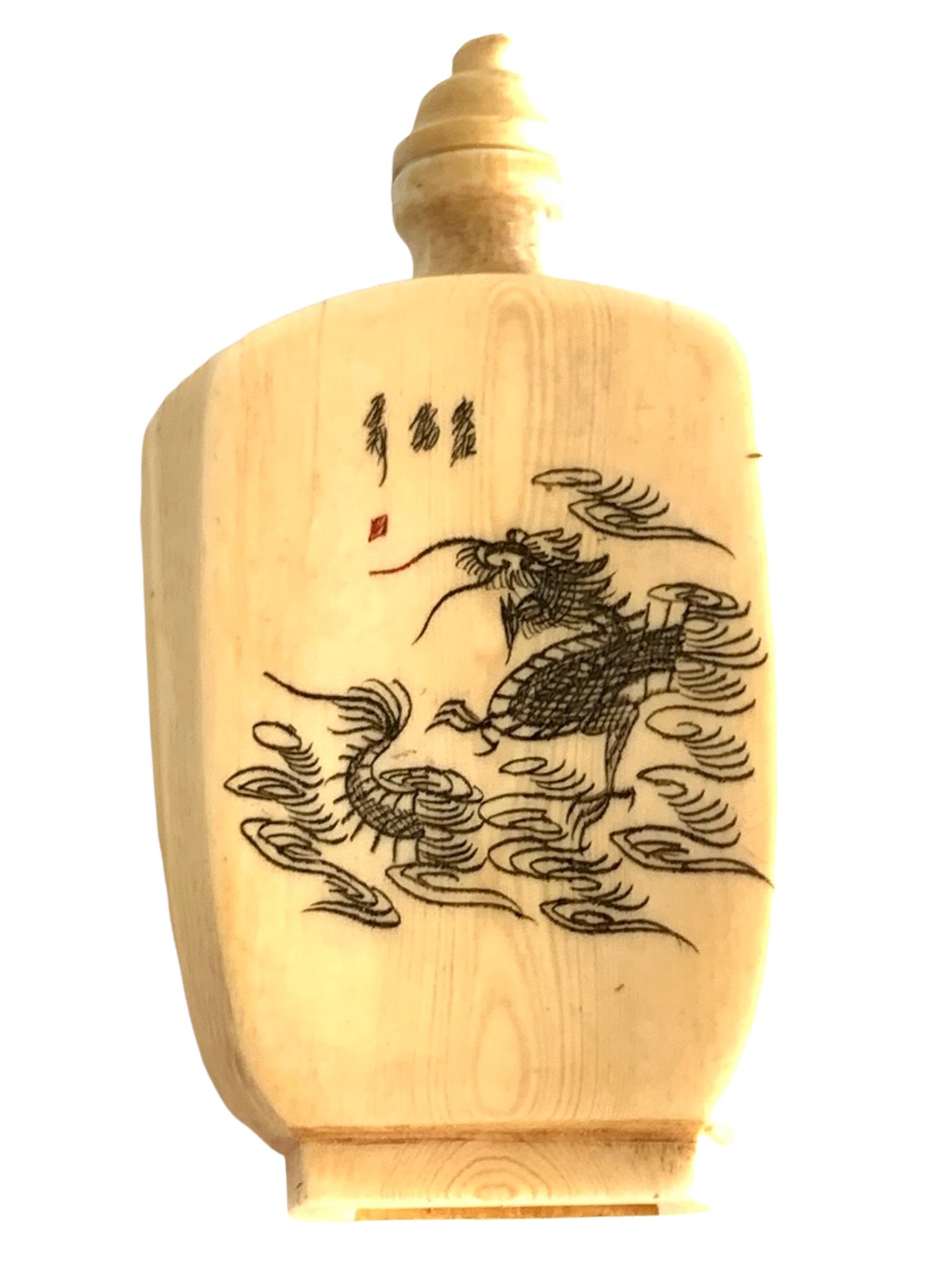A fine bone snuff bottle with dragon theme: 7.3cm x 4.1 cm