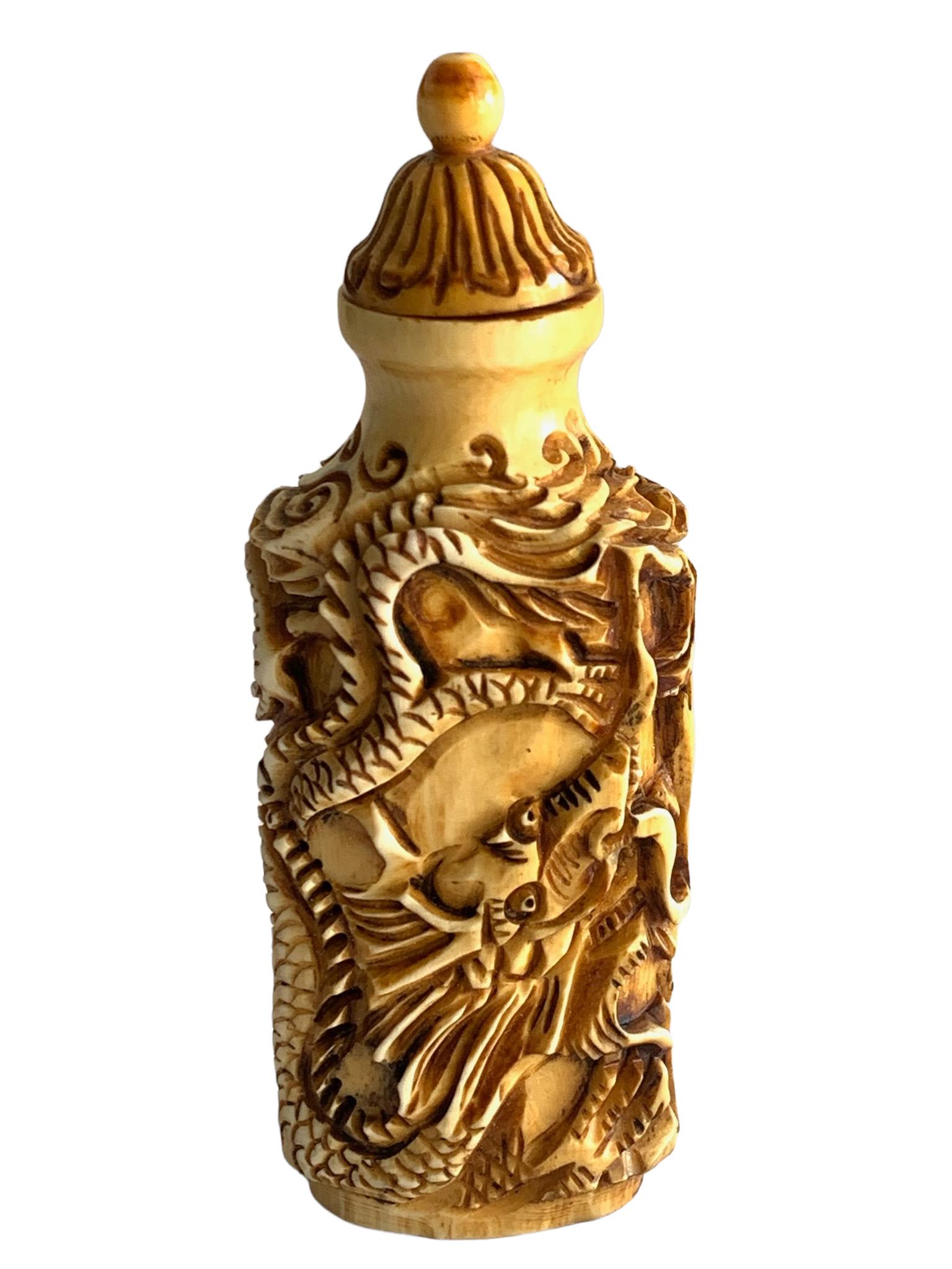 A fine bone snuff bottle with dragen pattern: a fine bone snuff bottle with dragen pattern 7.7cm x 2.7cm