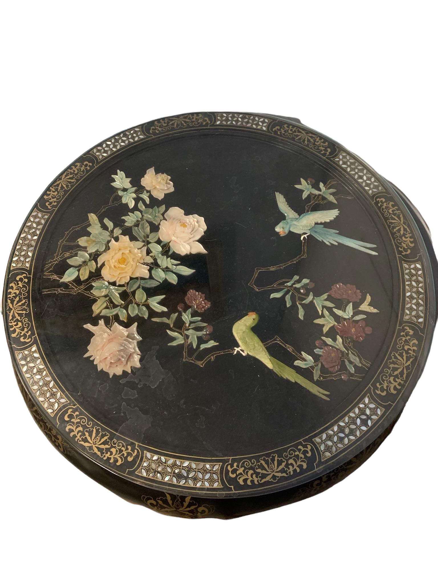 A chinese round table with 4 stools carved with flower pattern (1 of 5)