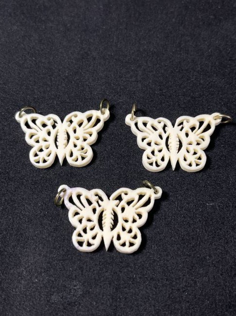 3 beautiful bone carved pendant and a bone carved brooch: 3 beautiful bone carved butterfly pendant and a bone carved brooch; pendant: 1.3"x0.75"