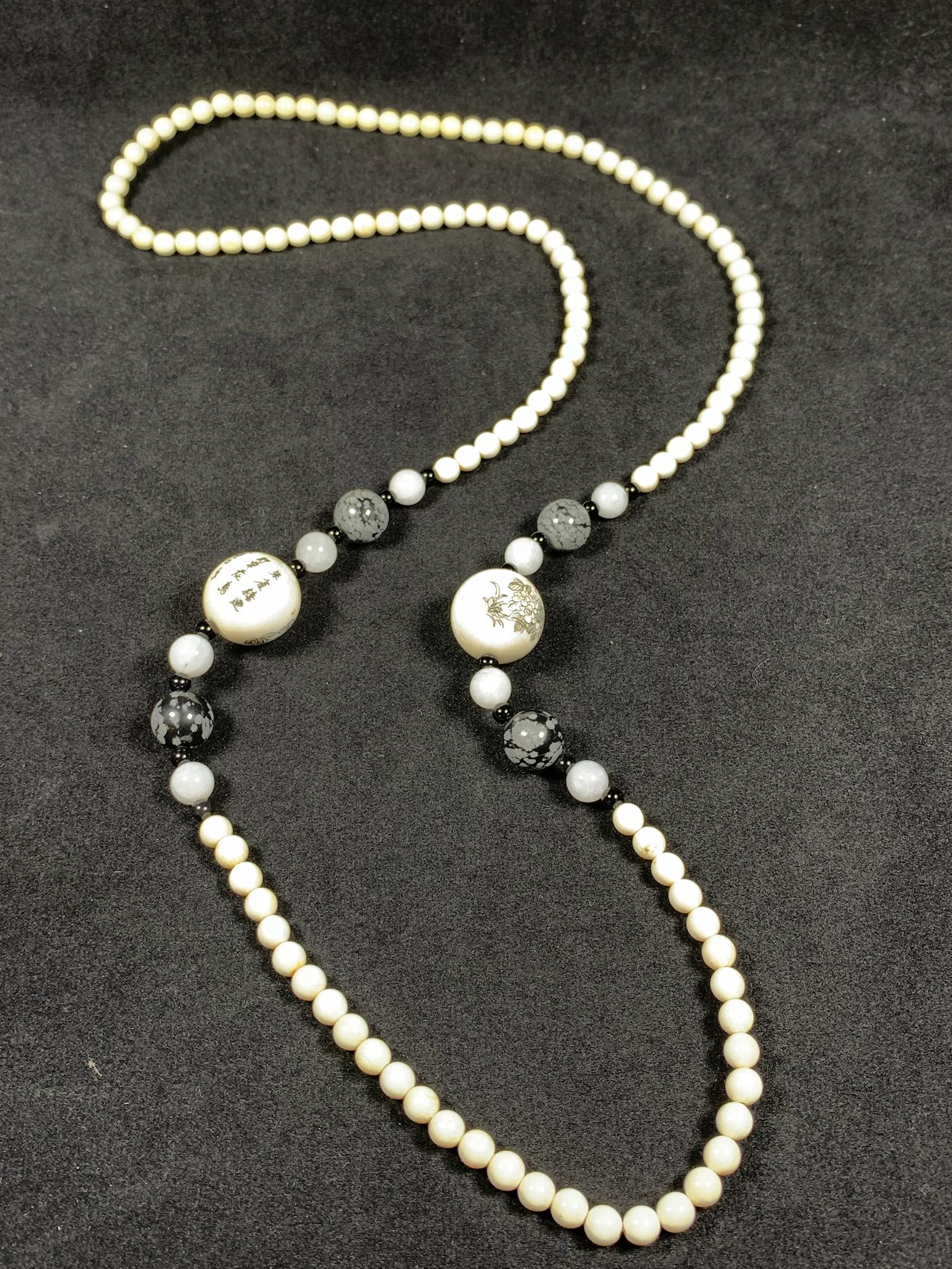 A chinese bone ,jade,, obsidian, and bone carved bead necklace; signed beads: L: 17.1"