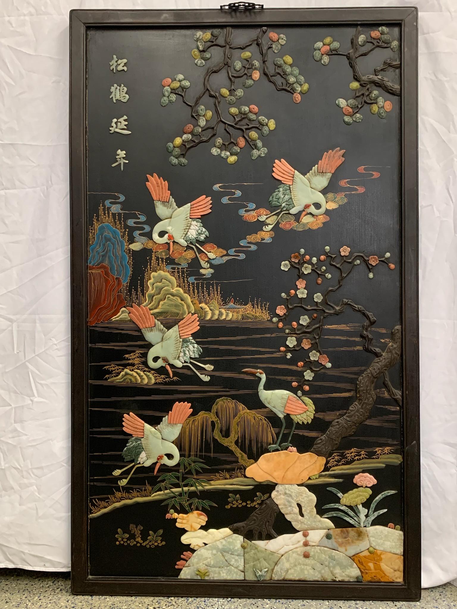 A large chinese black lacquered with jade, stone, and soapstone embedded: large chinese black lacquered with jade, stone, and soapstone embedded; H:55” W: 32.6”