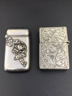 A pair of beautiful sterling silver carved lighter and match holder: pair of beautiful sterling silver carved lighte and match holder; flower theme; marked; 2.25"x1.5"