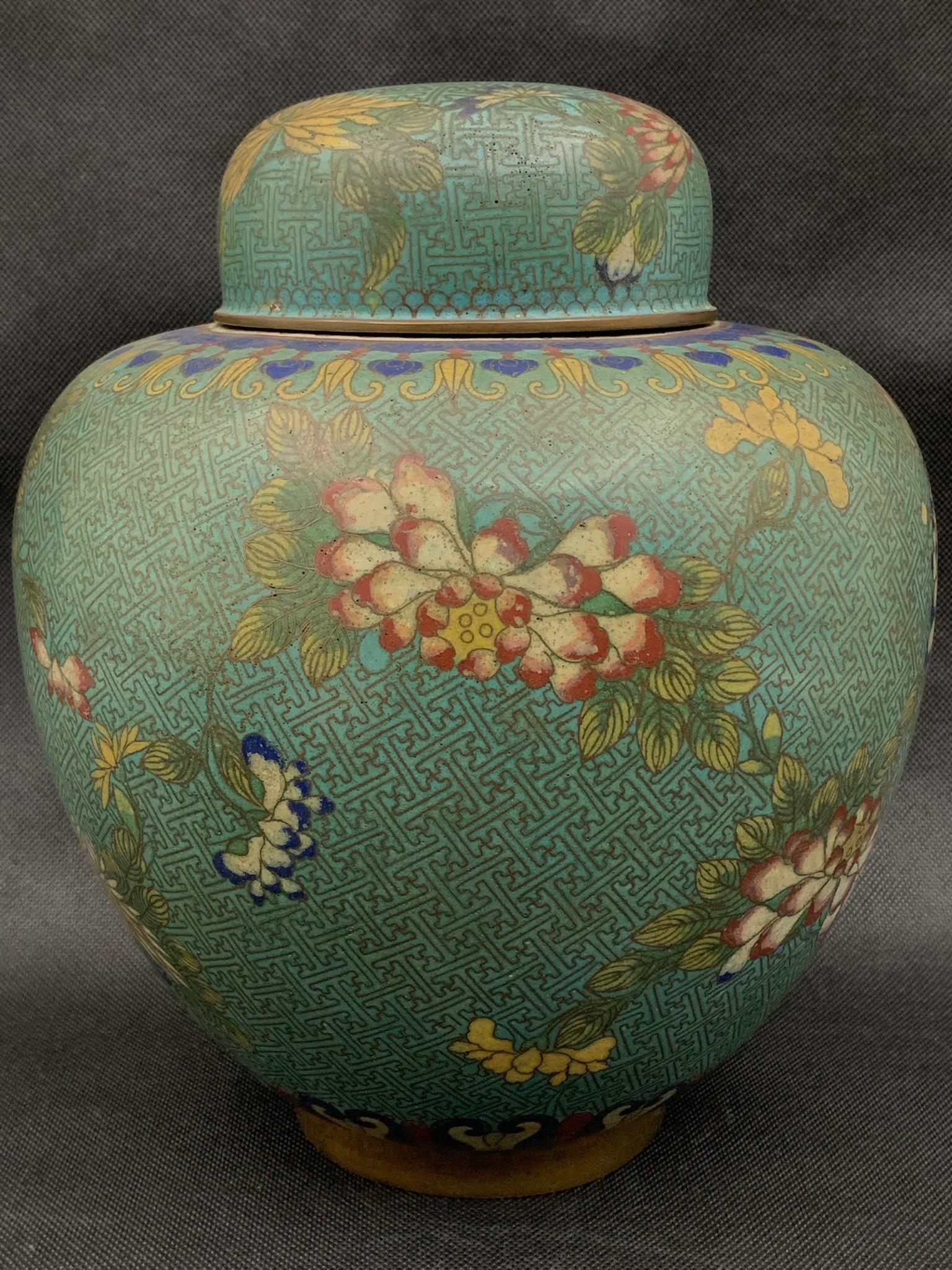 A fine chinese antique qing dynasty cloisonne jar: fine chinese antique qing dynasty cloisonne jar; with phoenix and flower theme; with export sticker; 10.5"H