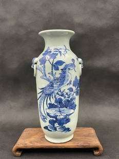 A chinese light color glazed blue and white flower and bird scene porcelain vase: chinese light color glazed blue and white flower and bird scene porcelain vase; stands not included. H. 10”