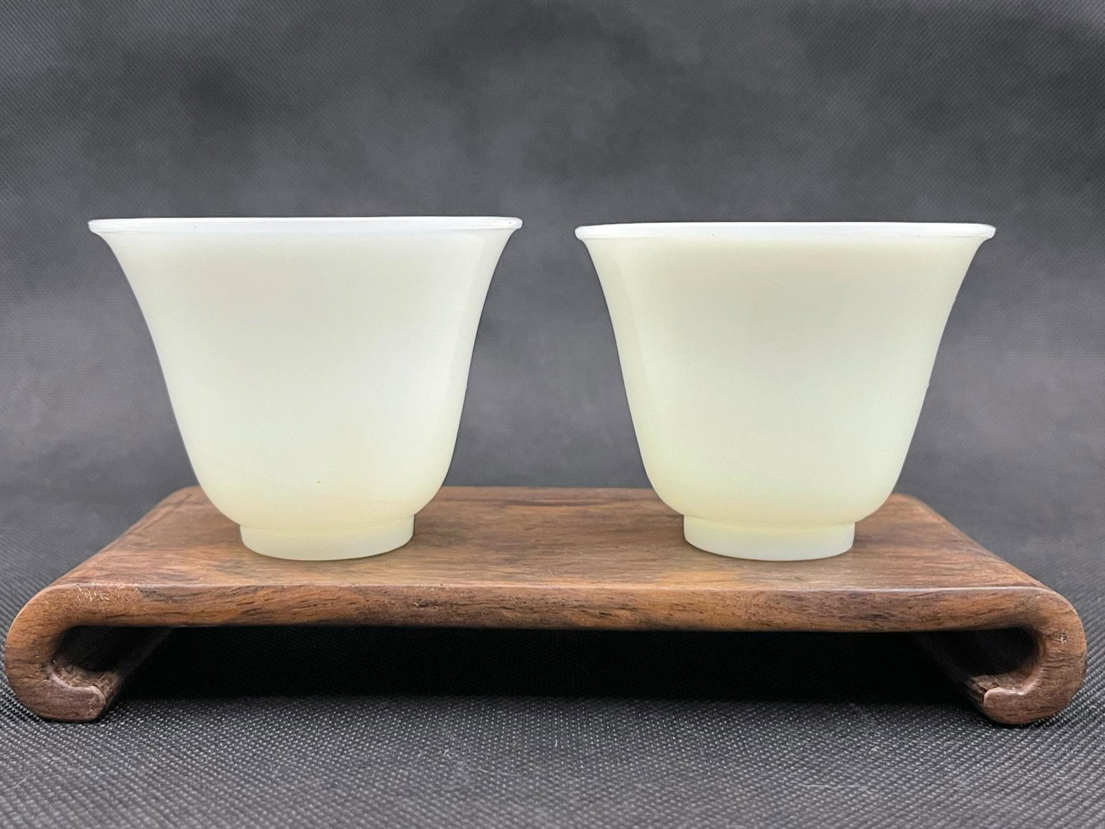A pair of chinese white peking glass cups: pair of chinese white peking glass cups; 2.9"H; stands not included