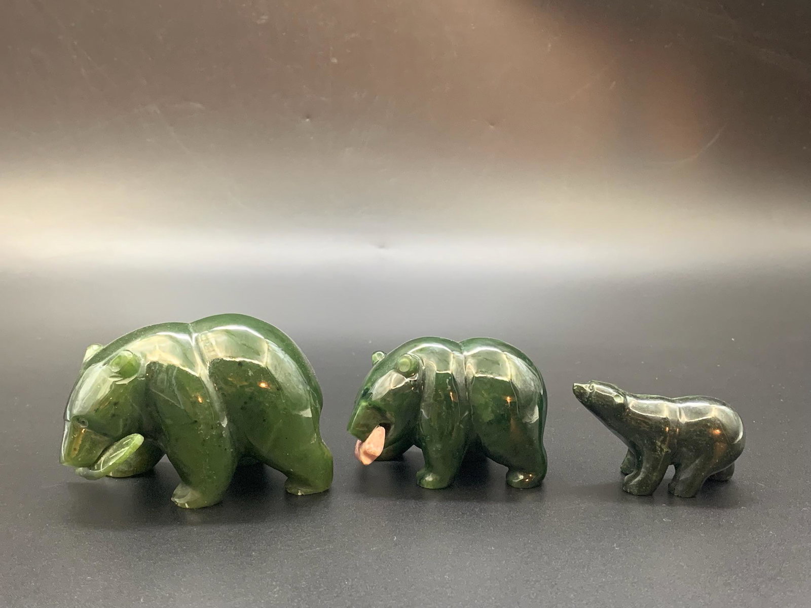 A set of chinese spinach jade carved polar bear: set of chinese spinach jade carved polar bear; 2" x 3"