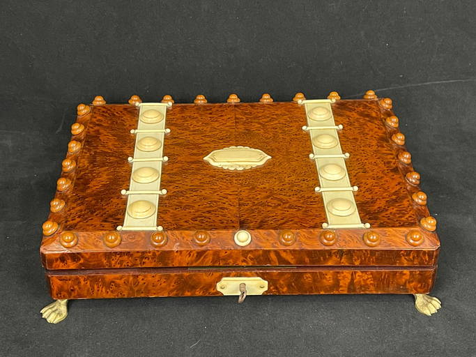 A fine burl wooden game box with bone carved embedded; bone tiles and