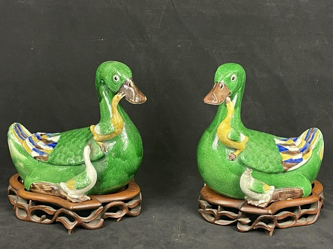 A pair of important chinese antique green glazed porcelain duck with rosewood stand: pair of important chinese antique green glazed porcelain duck with rosewood stand; see picture. H: 10.75”