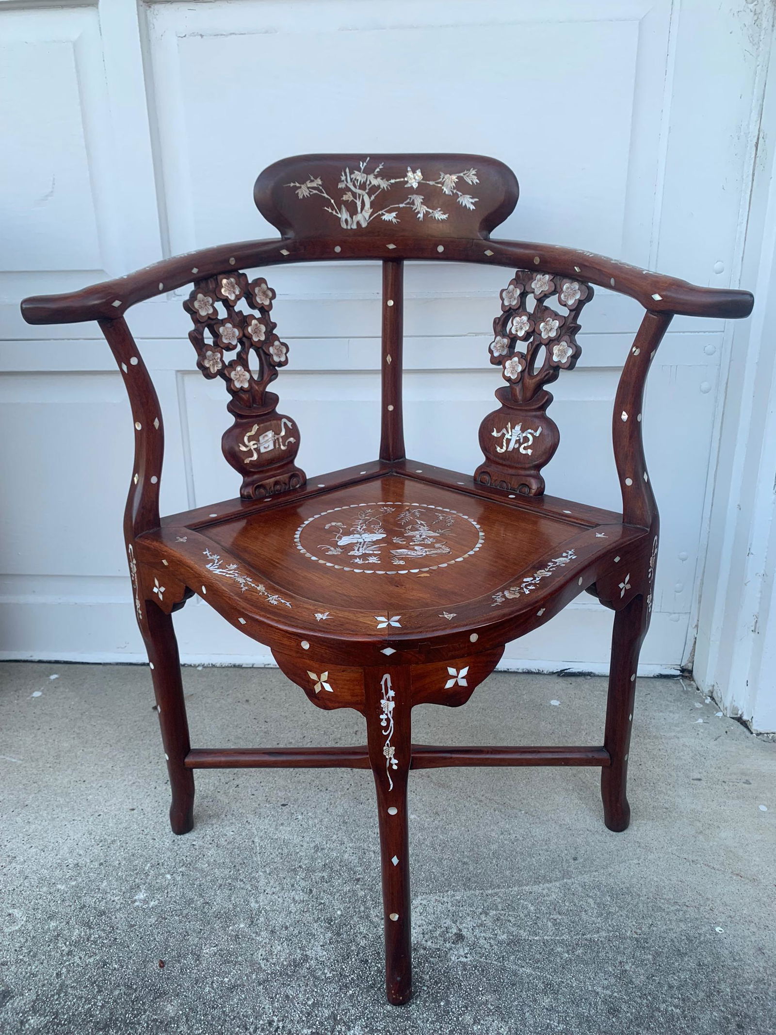 A chinese rosewood mother of pearl inlaid corner chair: chinese rosewood mother of pearl inlaid corner chair; H: 32”