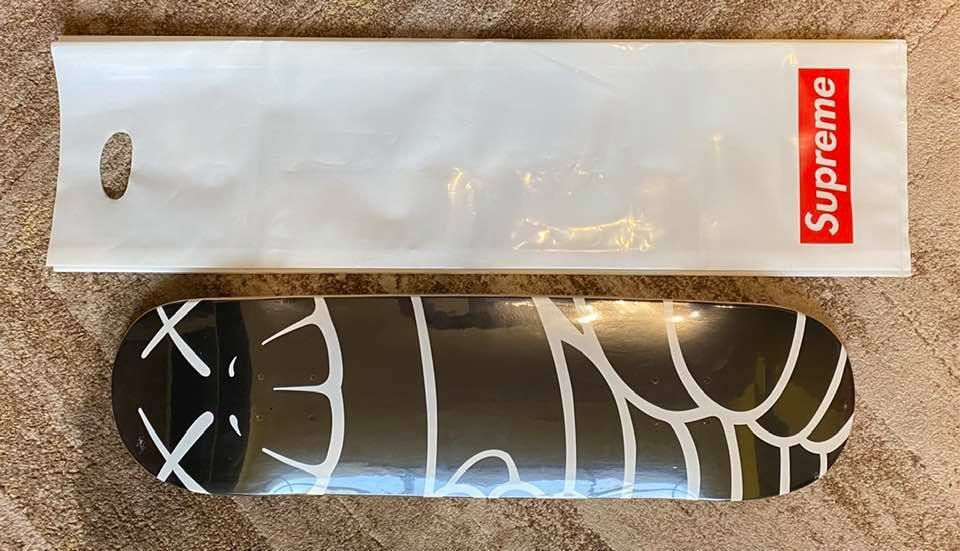 Supreme x Kaws Chalk Logo Skateboard | Red | FARFETCH