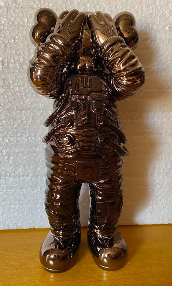 KAWS HOLIDAY SPACE FIGURE - BLACK: The KAWS Holiday Space Figure is literally out of the world. Prior to the release of this coveted collectible, KAWS teamed up with All Rights Reserved to send this figure into space. The artist shared