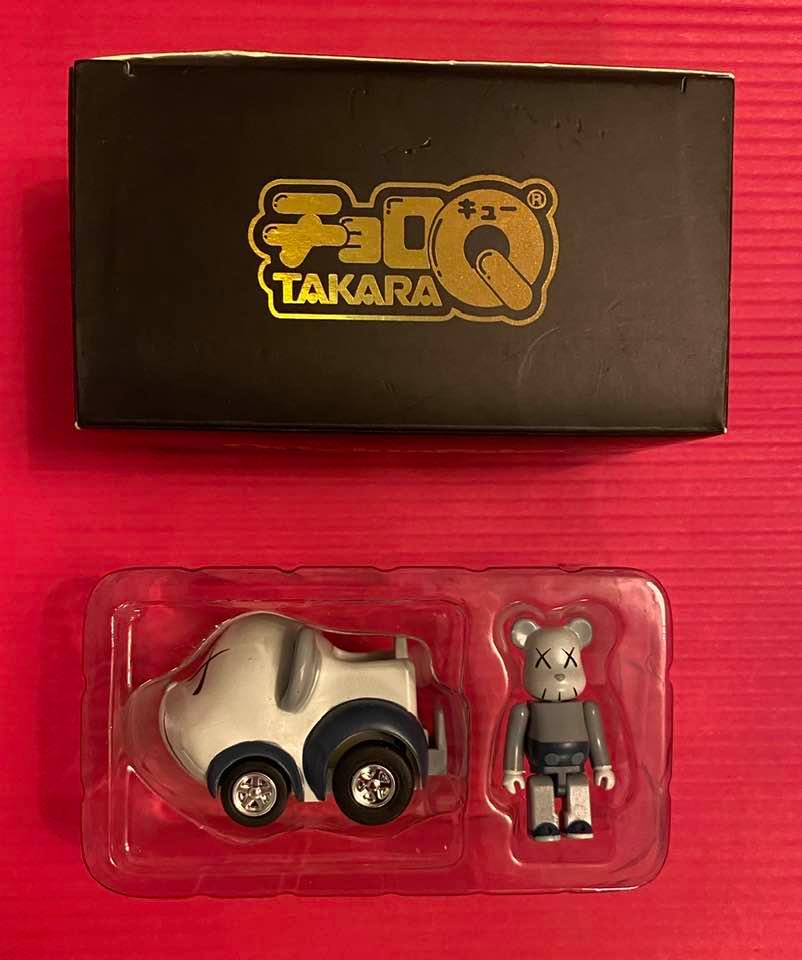 KAWS (born in 1974Â° TAKARA TOMY CHORO-Q: TAKARA TOMY CHORO-Q (Blue/Grey), 2007Painted cast vinylStamped on the reverseWith original packagingProduced by Medicom Toy and OriginalFake, TokyoDimensionToy : 3.5 x 1.9 x 1 cm - 1.4 x 0.75 x 0.4 in