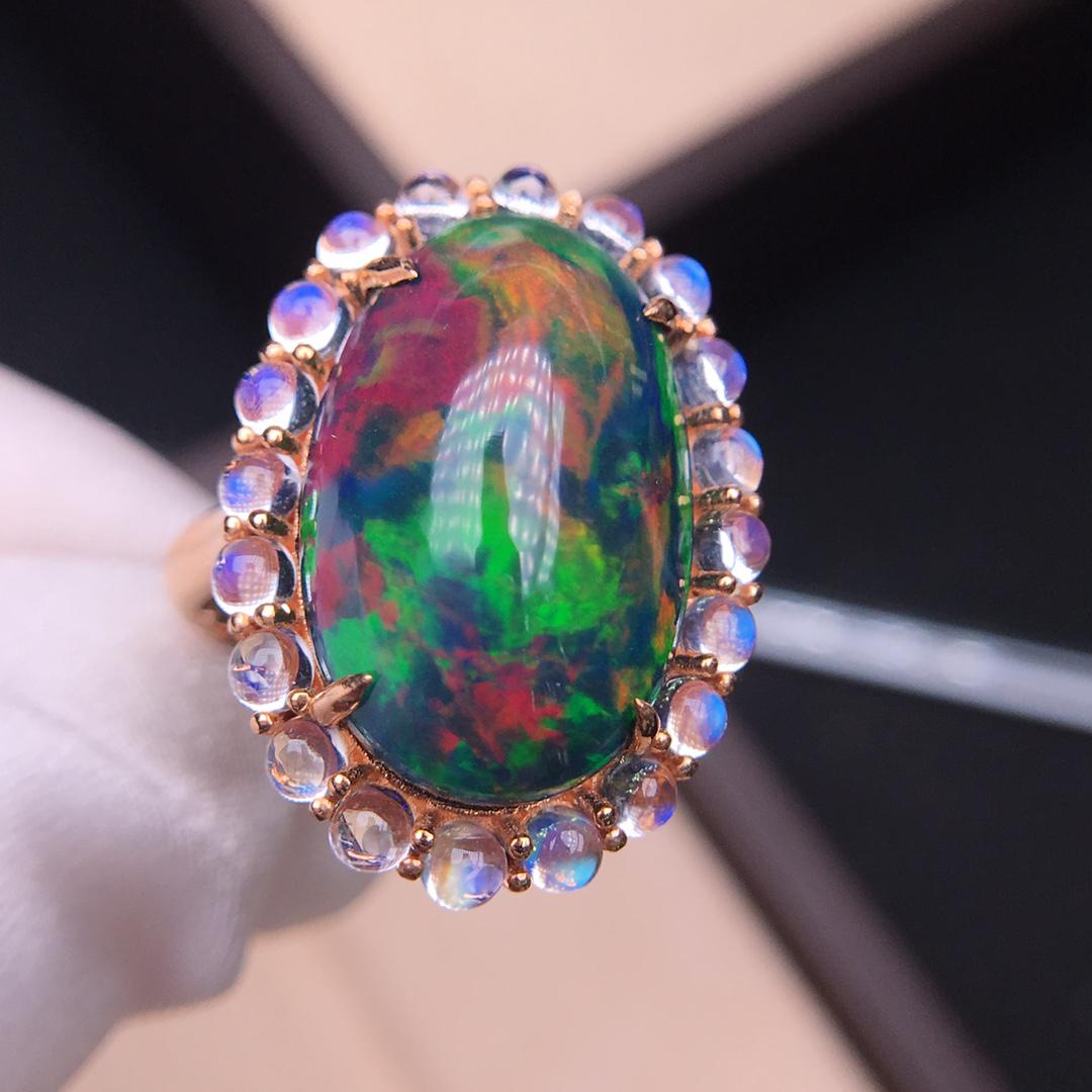 18K Yellow Gold 8.65 CT Opal & Moonstone Ring: Ref:4630 Gold Content:18K Yellow Gold For people:Women Weight of Item:7grams Ring Size:7.25US Main Gemstone:Opal Shape:Oval Carat Weight:8.65ct Clarity Grade:VS2 Color:Color Cut Grade:G Ad