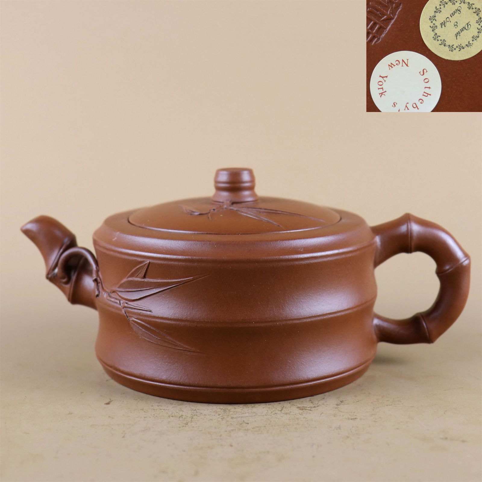 A Carved Yixing Zisha Teapot: A Carved Yixing Zisha Teapot , Ht. 7.8cm, Wd. 18cm,