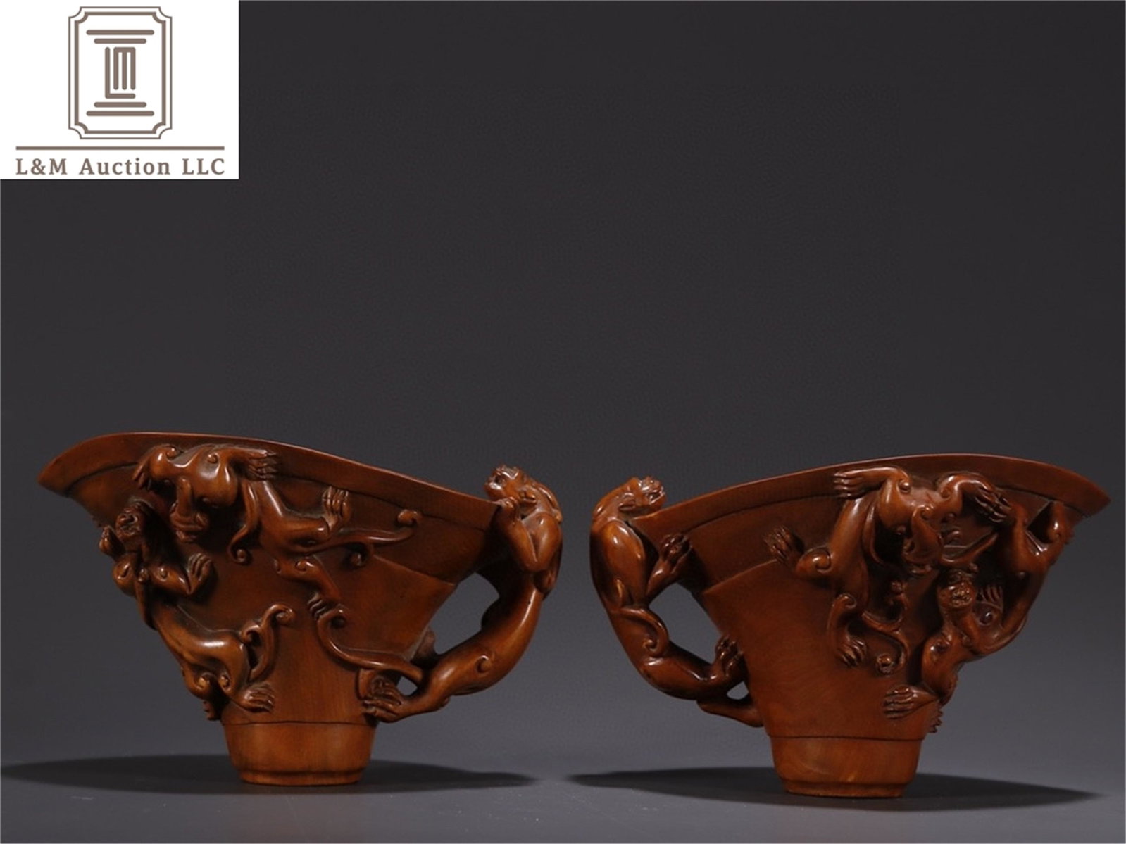 A Pair of Carved Hardwood Cup: A Pair of Carved Hardwood Cup, Ht. 7.8cm, Wd. 11.9cm,